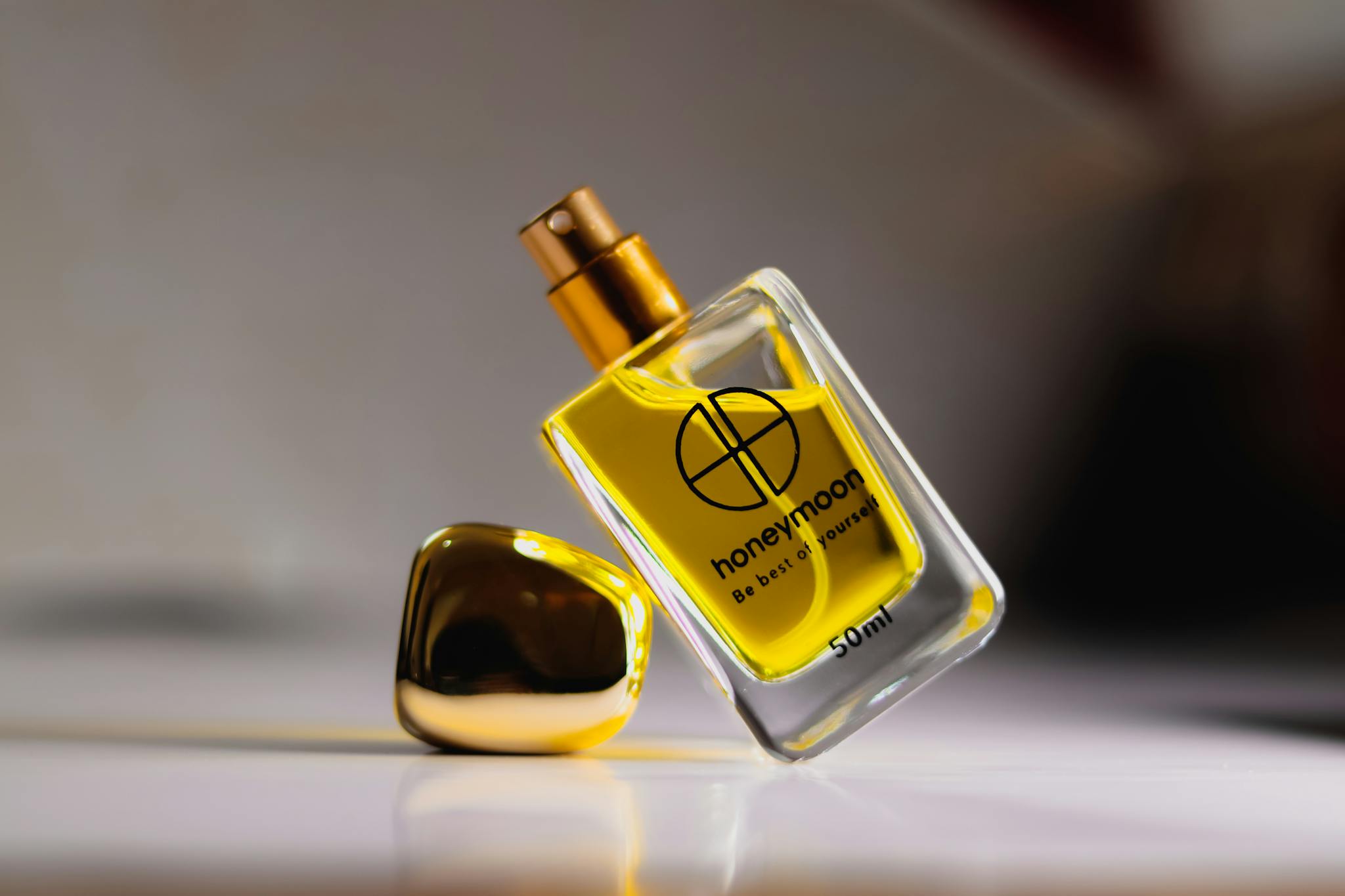 A luxurious perfume bottle with golden liquid, exuding elegance and sophistication in every detail.